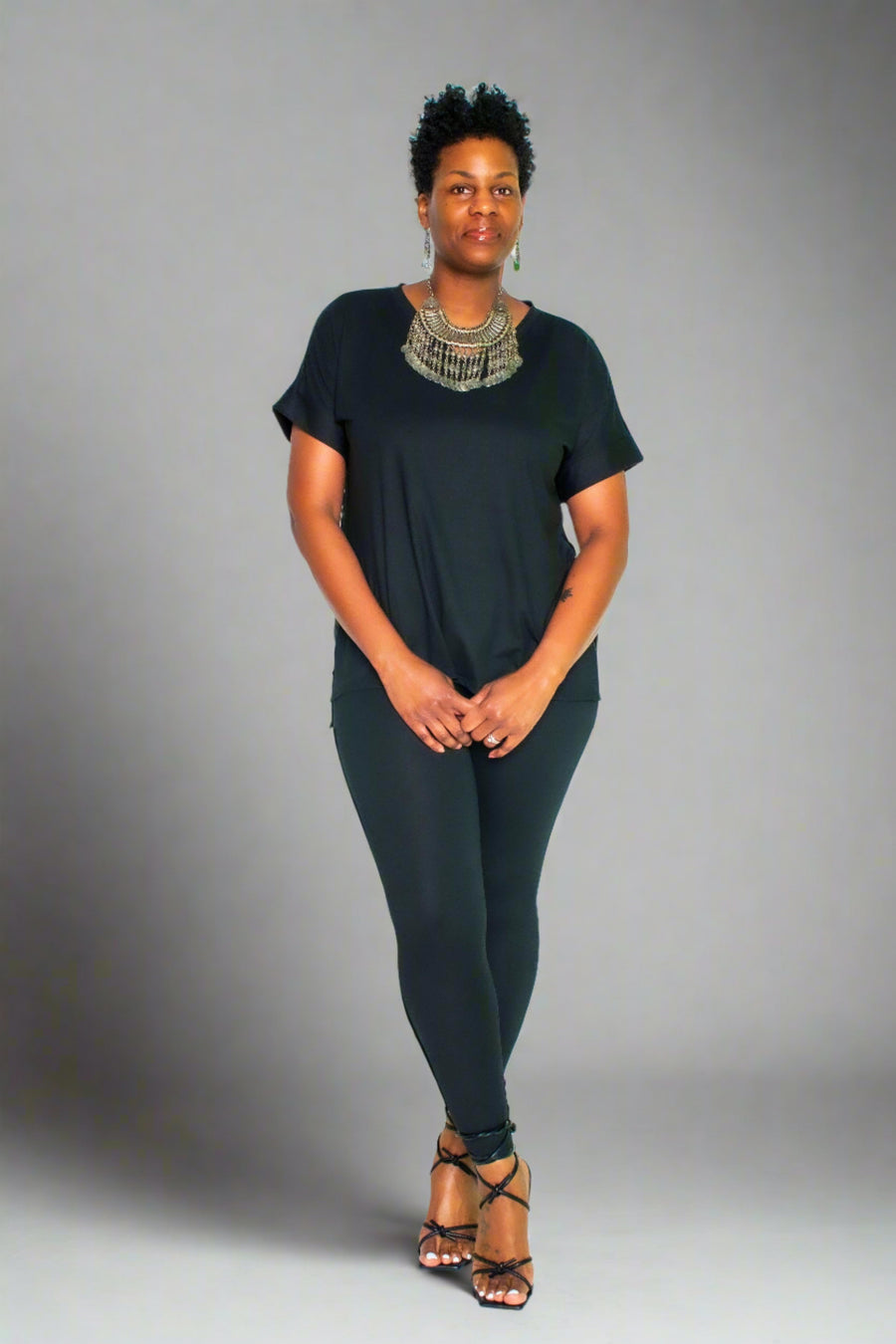 Experience the ultimate comfort and style with our Brushed DTY Microfiber V-Neck Top and Legging Set. This ensemble is designed to deliver unparalleled softness, courtesy of our buttery soft, 90% polyester and 10% spandex blend. The short sleeve top features a flattering V-neck, perfectly paired with matching leggings that offer the perfect stretch and recovery, ensuring you look and feel great with every move.  Product Description:
