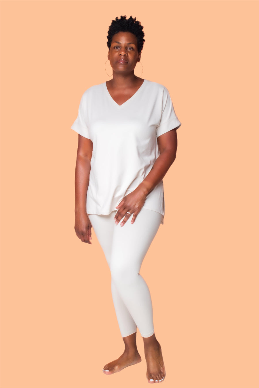 Experience the ultimate comfort and style with our Brushed DTY Microfiber V-Neck Top and Legging Set. This ensemble is designed to deliver unparalleled softness, courtesy of our buttery soft, 90% polyester and 10% spandex blend. The short sleeve top features a flattering V-neck, perfectly paired with matching leggings that offer the perfect stretch and recovery, ensuring you look and feel great with every move.  Product Description:
