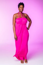 Fuchsia Wide Leg Jumpsuit  Introducing our Fuchsia Wide Leg Jumpsuit, crafted from stretch material to ensure a comfortable fit that runs slightly large. This sleeveless jumpsuit features wide legs and practical pockets, offering both style and functionality. The vibrant fuchsia hue adds a bold and stylish statement to your wardrobe, perfect for making a standout impression.  Key Features:  Fuchsia Color: Vibrant and eye-catching.