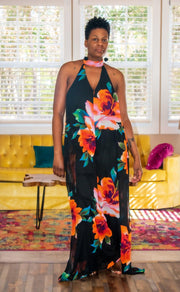 Black Multi Halter Style Jumpsuit  Elevate your wardrobe with our Black Multi Halter Style Jumpsuit, a chic and versatile piece perfect for various occasions. This jumpsuit features a halter neckline and a daring backless design that exudes confidence. The deep V-neckline enhances the elegant silhouette, while wide legs provide comfort and movement.  Key Features:  Color: Black Multi, offering a blend of sophistication and vibrancy. Halter Style: Adds a stylish and flattering neckline.