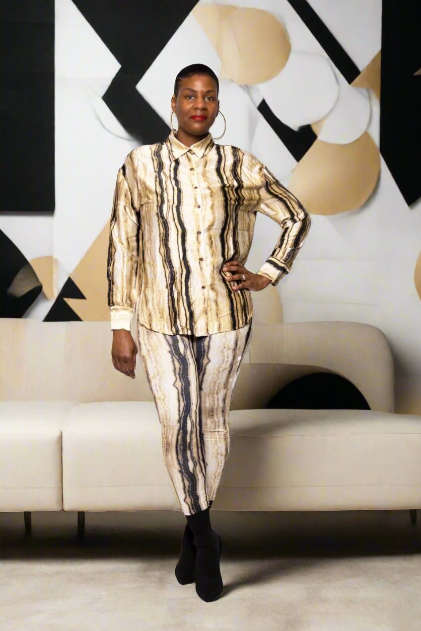 Welcome to the epitome of dreamy textures and chic style with our Black Multi 2PC Set. This set features a luxuriously smooth satin top with a sleek collar, paired with ruched leggings that boast a flattering high-waisted fit. Perfectly blending comfort with high-fashion aesthetics, this set is designed for the modern woman who loves to stand out in style. Available in a striking multi-color design, it's a versatile addition to any wardrobe, ensuring you look ultra chic whether at a brunch or a night out.