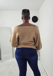 Bold abstract design women’s knit sweater with one-shoulder detail, cozy yet stylish statement piece.