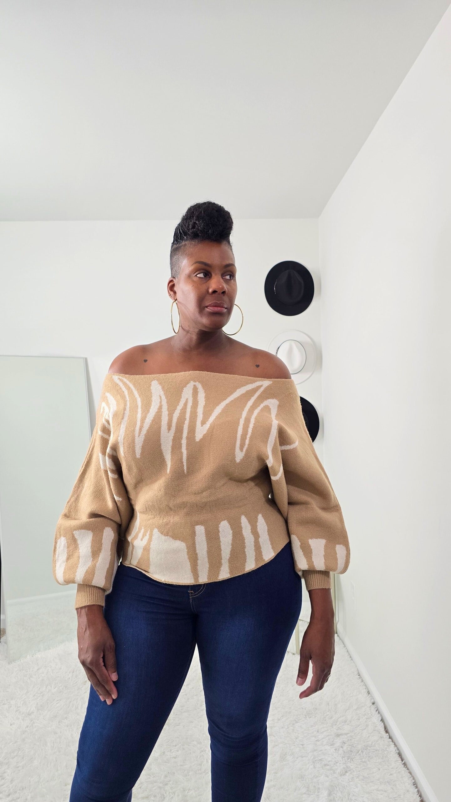 Bold abstract design women’s knit sweater with one-shoulder detail, cozy yet stylish statement piece.
