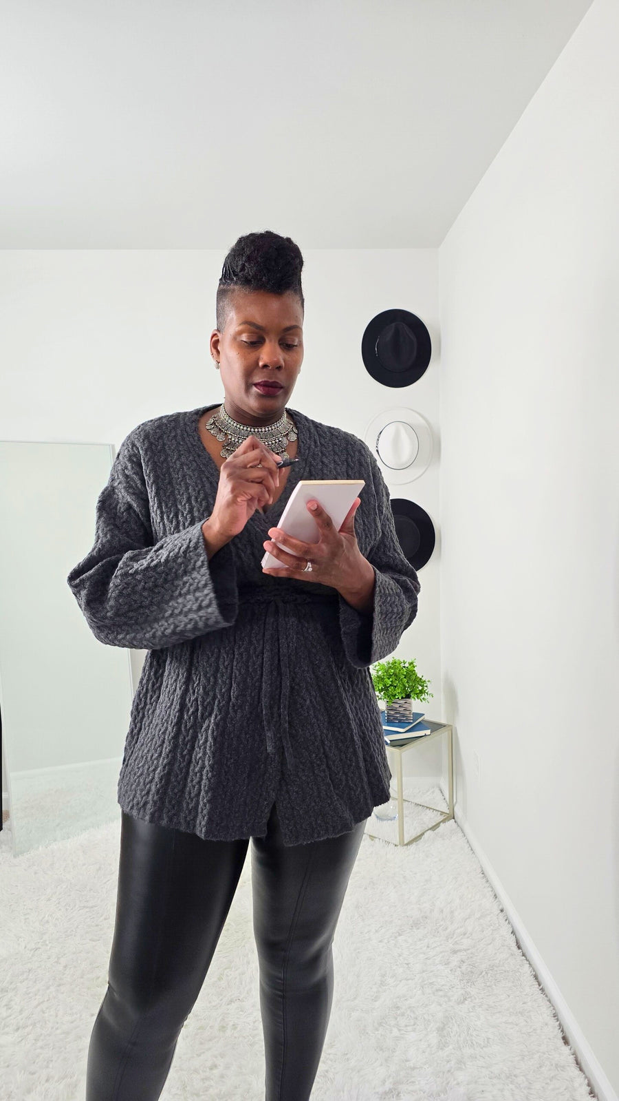 Relaxed fit women’s cardigan with V-neckline, long sleeves, and adjustable drawstring for versatile styling.