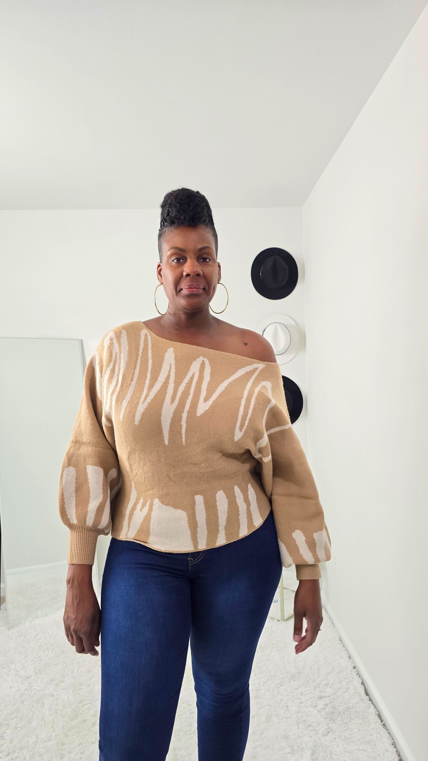 Bold abstract design women’s knit sweater with one-shoulder detail, cozy yet stylish statement piece.