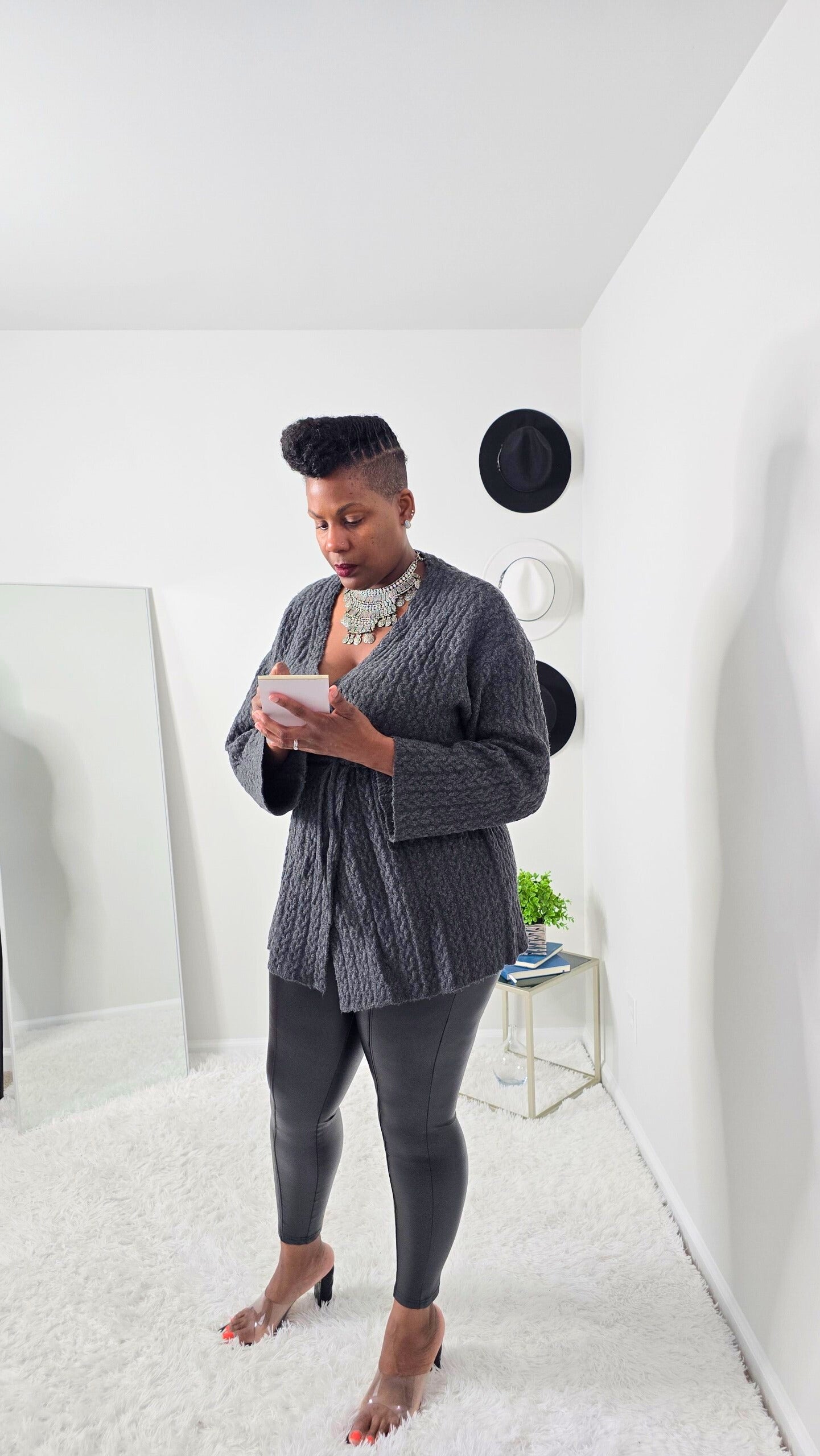 Relaxed fit women’s cardigan with V-neckline, long sleeves, and adjustable drawstring for versatile styling.