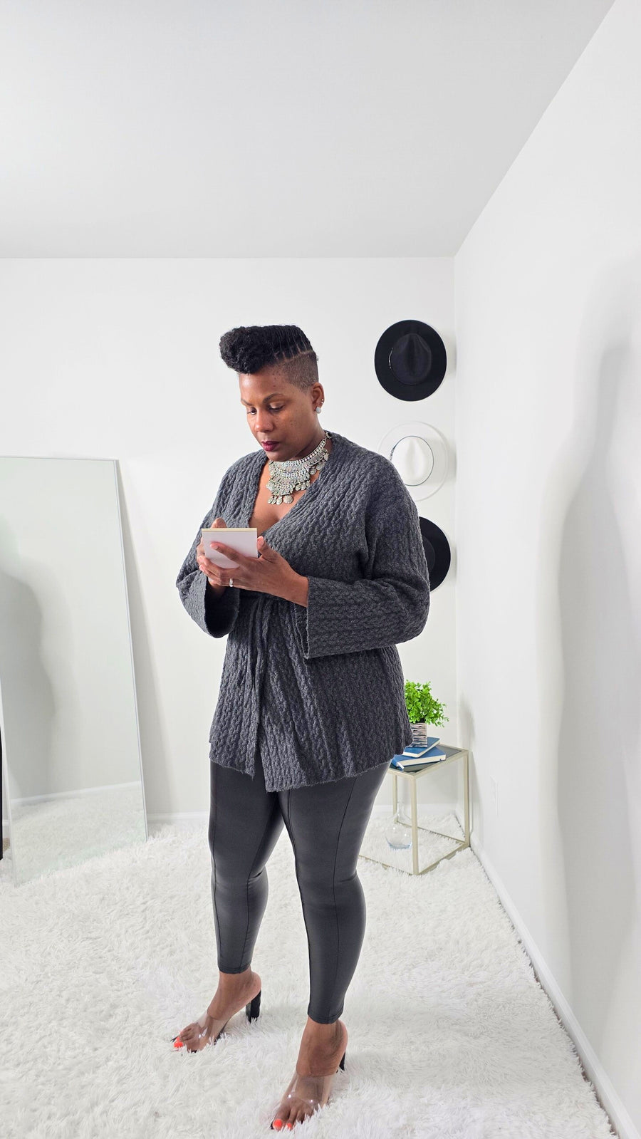 Relaxed fit women’s cardigan with V-neckline, long sleeves, and adjustable drawstring for versatile styling.
