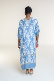 Available in Denim Damask Print  Elevate your style with our beautifully crafted top, available in a stunning denim damask print. This versatile piece is perfect for any occasion, blending elegance with casual charm.  Key Features:  Split Angel Sleeves: Add a touch of sophistication and flowy elegance with our unique split angel sleeves. Mini Pom Pom Accent: Delicate mini pom pom accents along the edges provide a playful yet chic detail. 100% Viscose: 