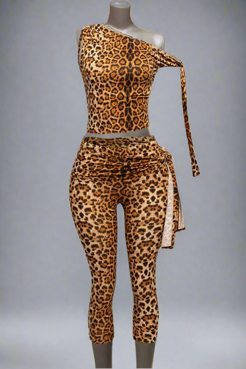 sleeveless leopard print two-piece set with an asymmetrical neckline and fitted capri pants, 