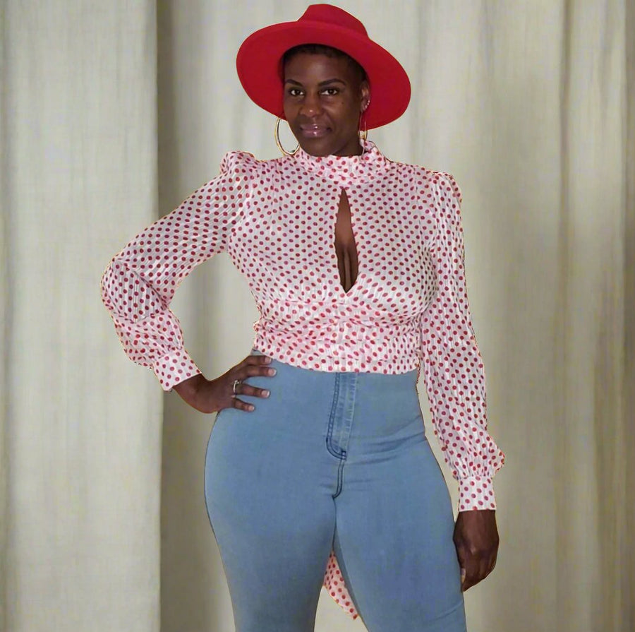 Red/White Polka Dot Chiffon Crop Top from Tosh`E Boutique, featuring a playful polka dot pattern with long sleeves, an open back, and a deep keyhole detail. Made from lightweight chiffon, this breezy crop top adds chic style to any wardrobe.