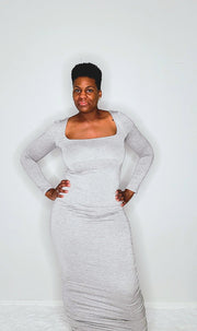 A stylish grey long sleeve full-length dress with a square neckline, soft and stretchy fabric made from 95% Rayon and 5% Spandex, featuring ruched sides for a flattering silhouette. Perfect for casual outings, work, or evening events.