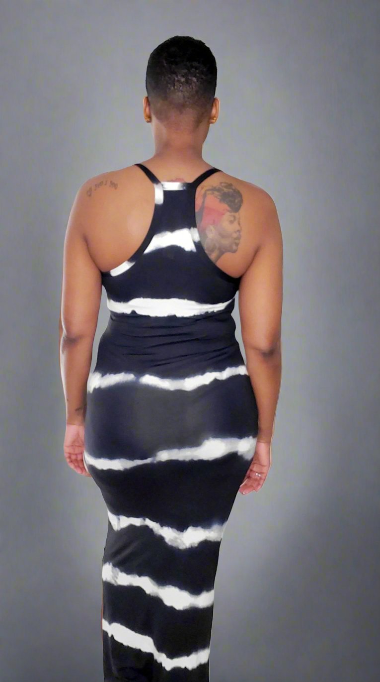 Stylish black tie dye V-neck maxi dress featuring a flattering fit with spaghetti straps and crafted from a blend of 92% polyester and 8% spandex for comfort and stretch. The dress showcases a trendy tie-dye pattern, combining elegance with a relaxed vibe, perfect for warm days and casual outings.