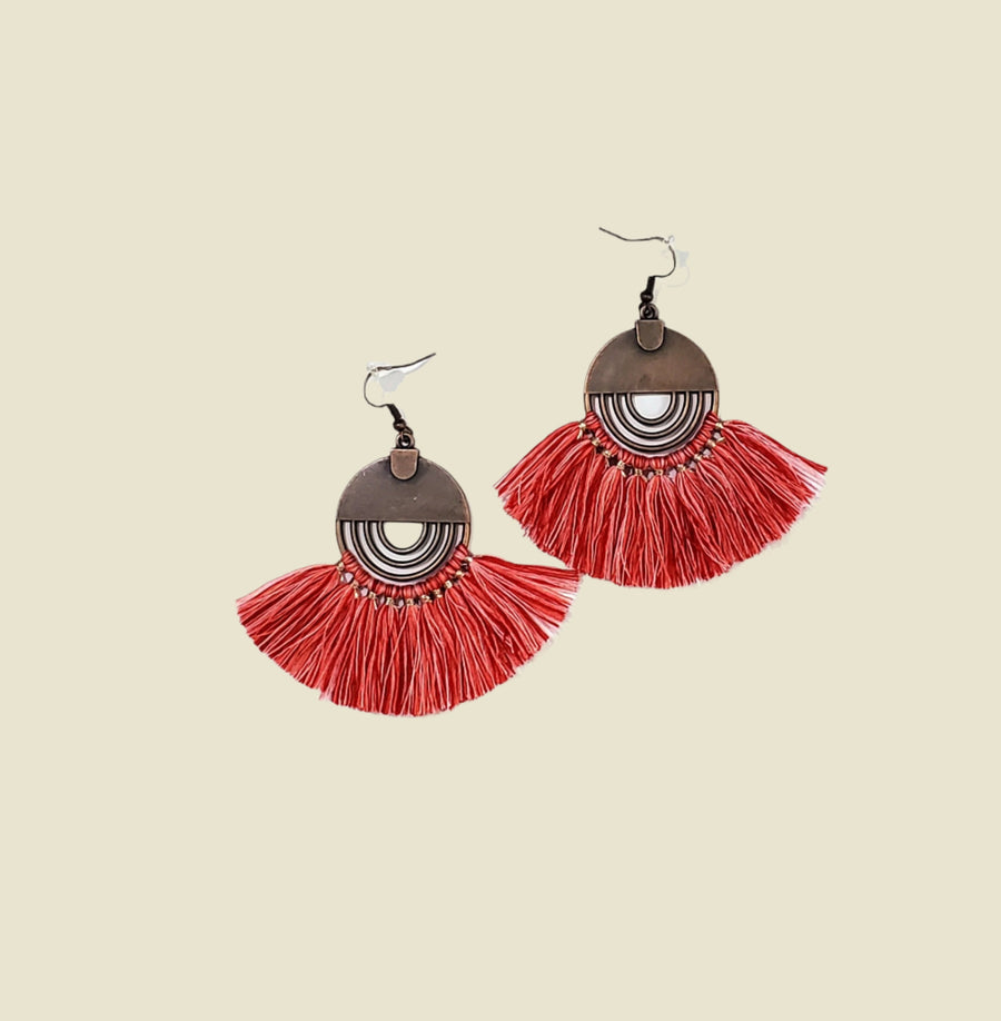 Elegant and vibrant Red Tassel Earrings, handcrafted with meticulous attention to detail. Featuring luxurious deep red tassels that add sophistication and depth to any ensemble. These timeless earrings are perfect for enhancing formal outfits or adding a touch of elegance to everyday wear