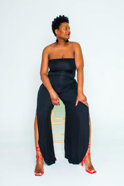 Tackle Your Adventurous Side with Our Stylish Strapless Jumpsuit!  Perfect for your daring spirit, this jumpsuit features a chic strapless cut, a sleek side slit, and wide-leg pants for ultimate comfort and style. Made to inspire your inner wild child, this jumpsuit encourages you to take the plunge and embrace boldness.  Key Features:  Strapless Design: Show off your shoulders with confidence. 