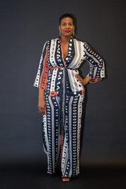 Luxurious Multi Print Kimono Set from Tosh`E Boutique, featuring a flowing open-front kimono top and high-waisted wide-leg satin pants. Crafted from a premium blend of satin and spandex, this two-piece ensemble includes practical pockets and a contemporary black belt to accentuate the waist. Ideal for special events or adding elegance to your everyday style.