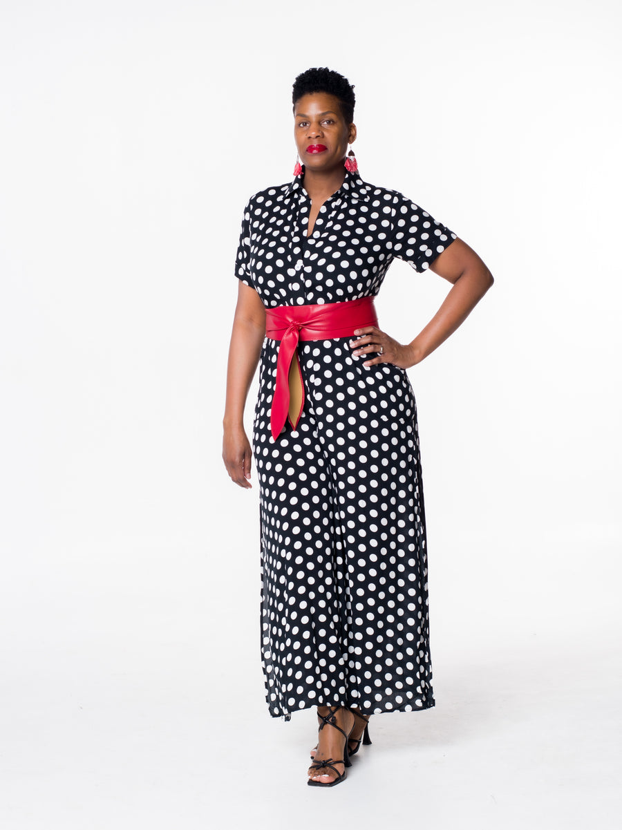 A classic look with timeless appeal, this polka dot jumpsuit is expertly crafted from breathable cotton-blend fabric. Featuring a V-neckline, side slits, and pockets, this jumpsuit evokes a relaxed yet stylish fit. Comes with a complimentary face mask for a complete, modern look. Belt is not included.  