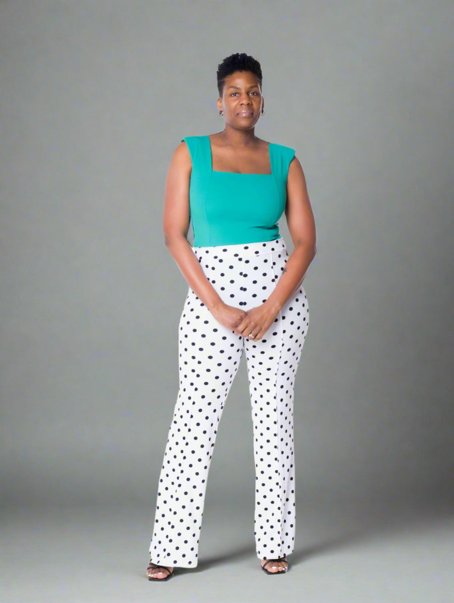 These stylish high-waisted polka dot pants feature a comfortable elastic waistband, stretch crepe knit fabric, and a 35" inseam. The unique pintuck detail ensures a perfect fit and a bold style.  Features:  High Waisted: Flattering and trendy design Elastic Waistband: Provides a comfortable and secure fit Pintuck Detail: Ensures a perfect fit and adds a stylish touch 35" Inseam: Ideal for a polished look